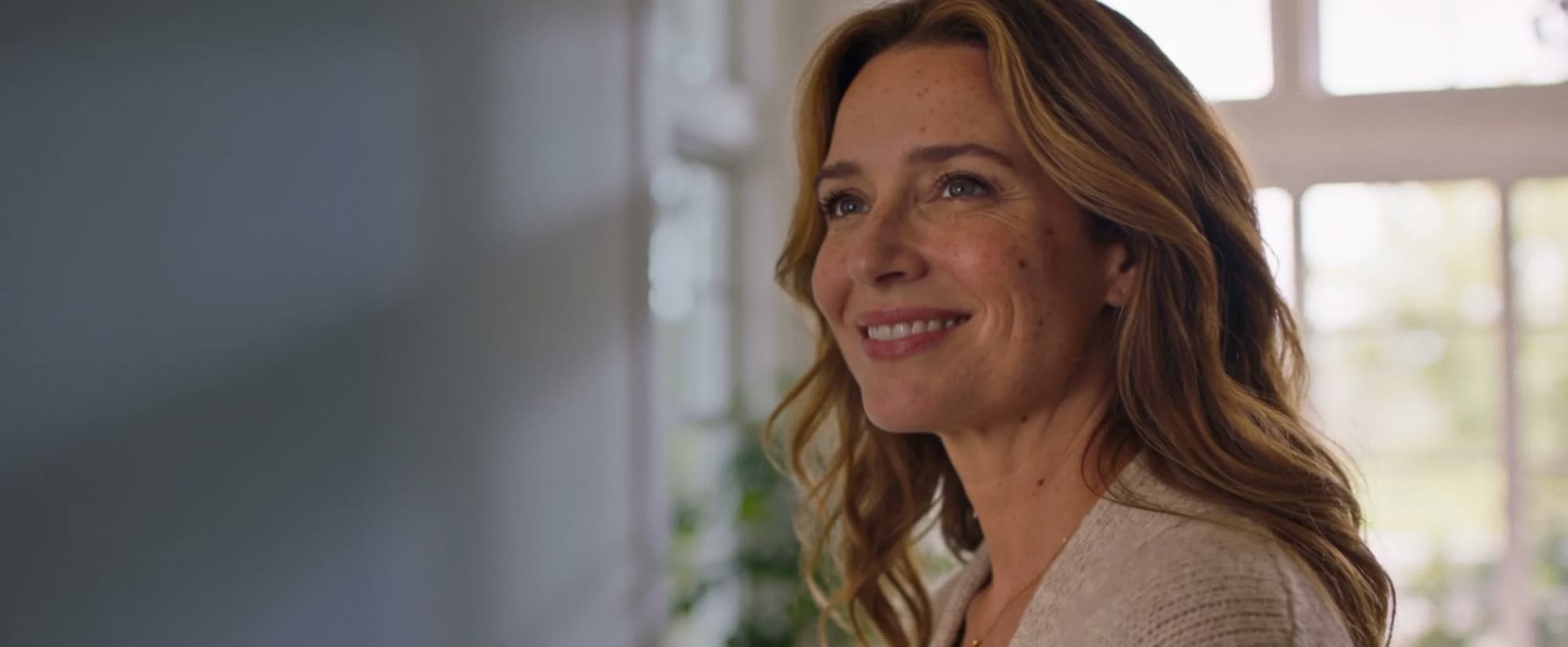 A smiling woman in her forties