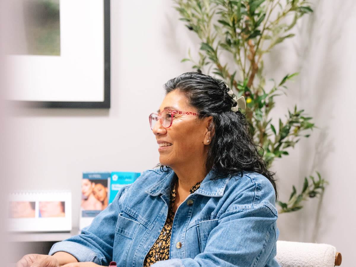 A smiling woman at a consultation