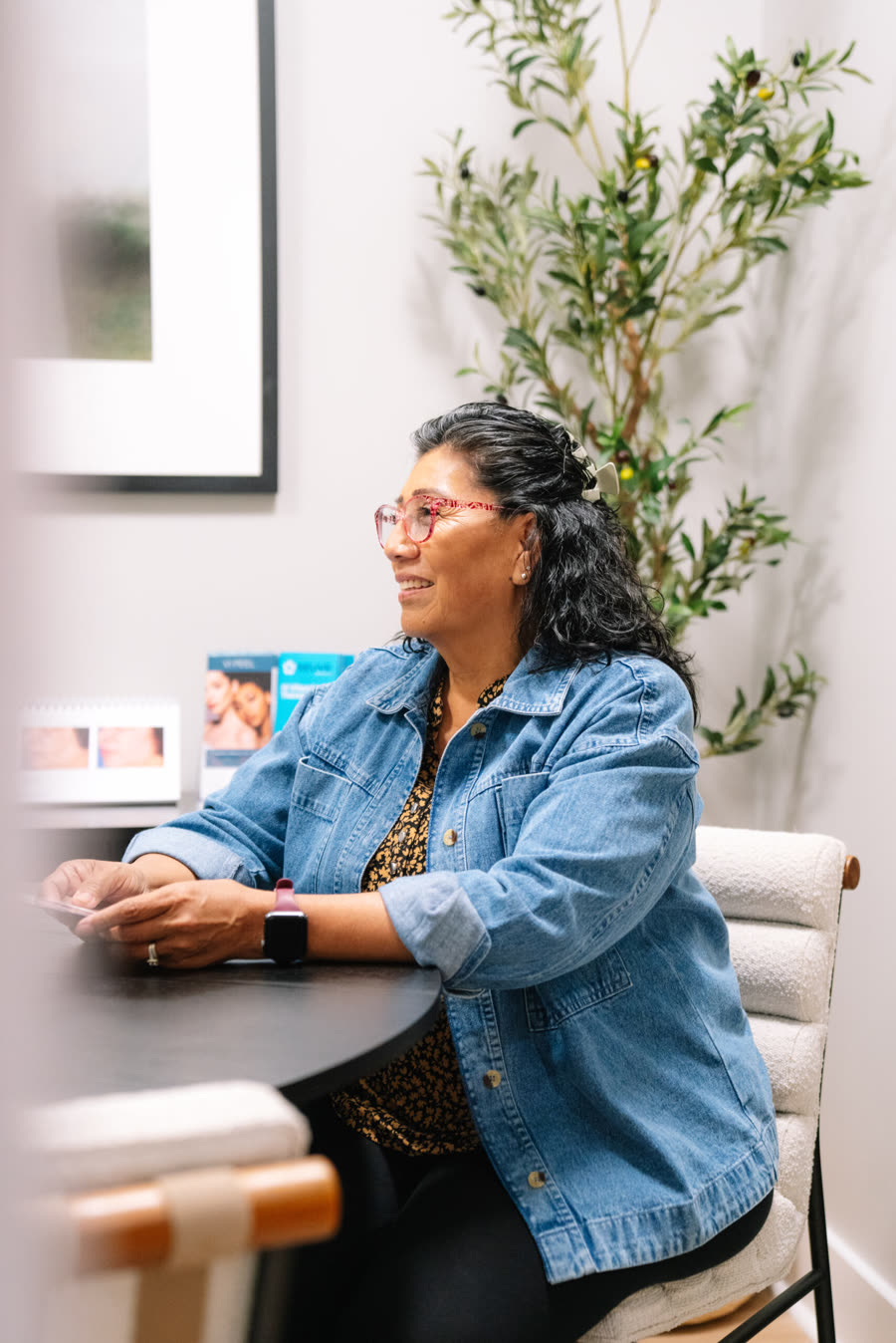 A woman smiling during a visit at Relive Health