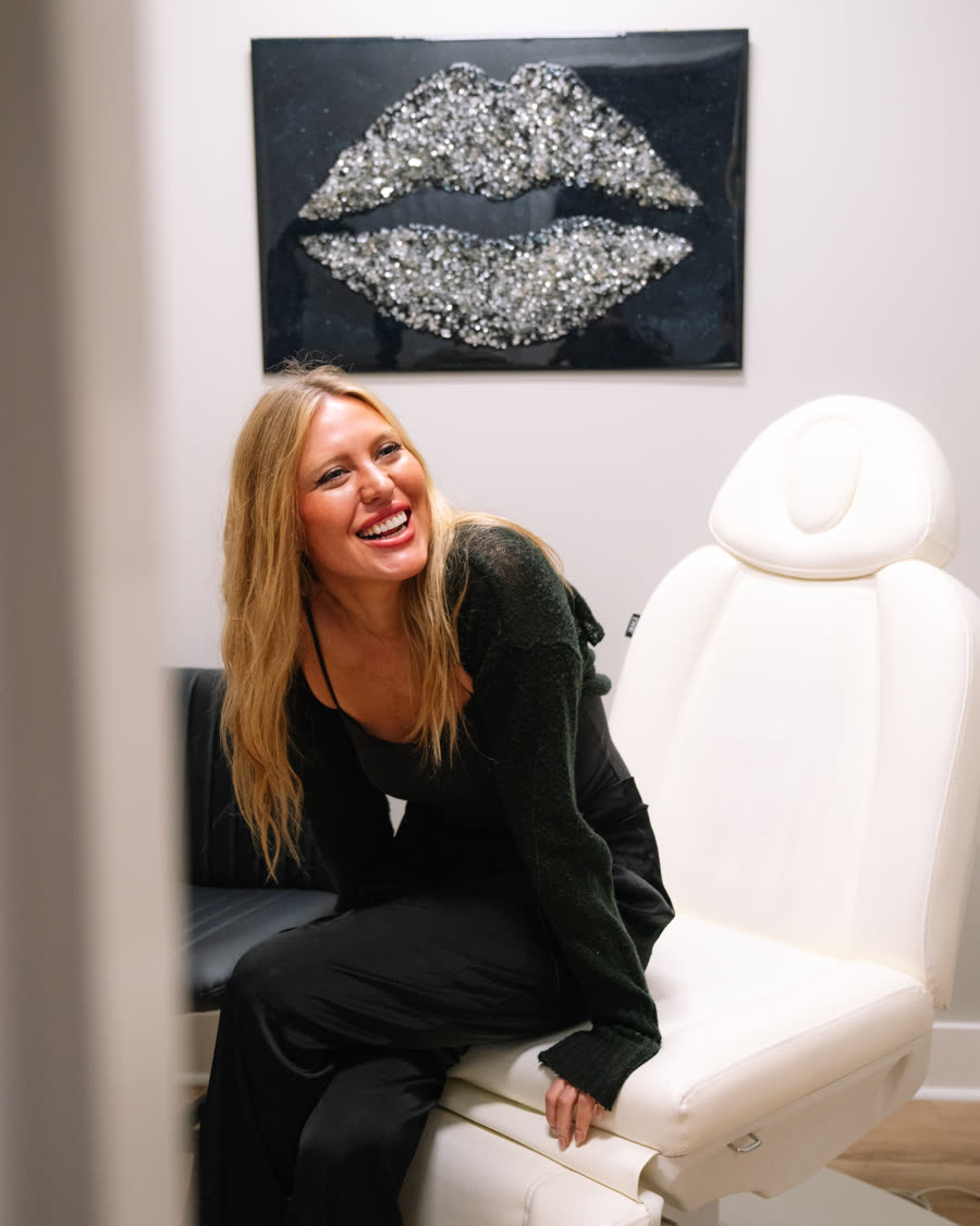 A woman laughing during a visit at Relive Health